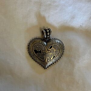 Heart-Shaped Silver Pendant with Intricate Design